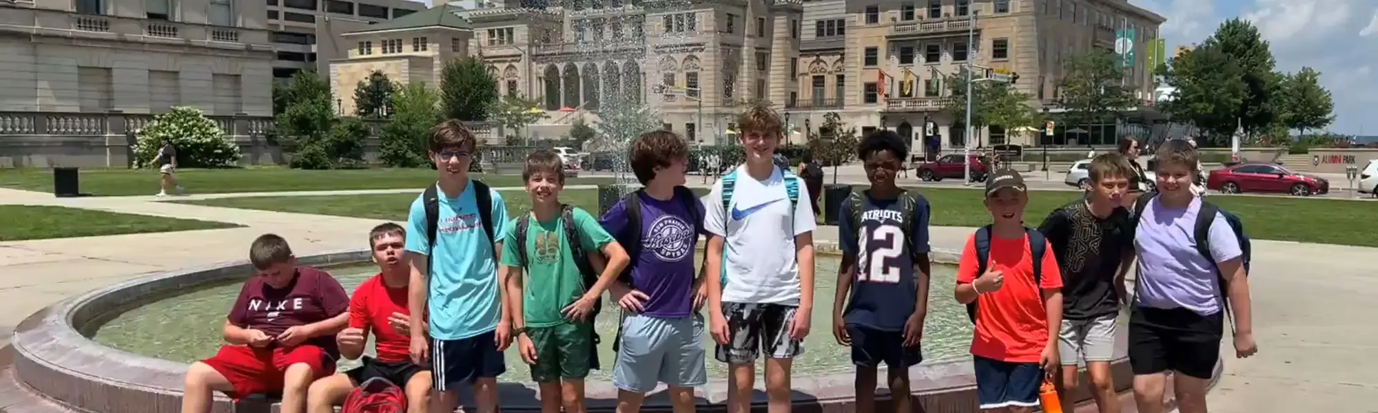 Kids outside by water fountain Kids outside by water fountain